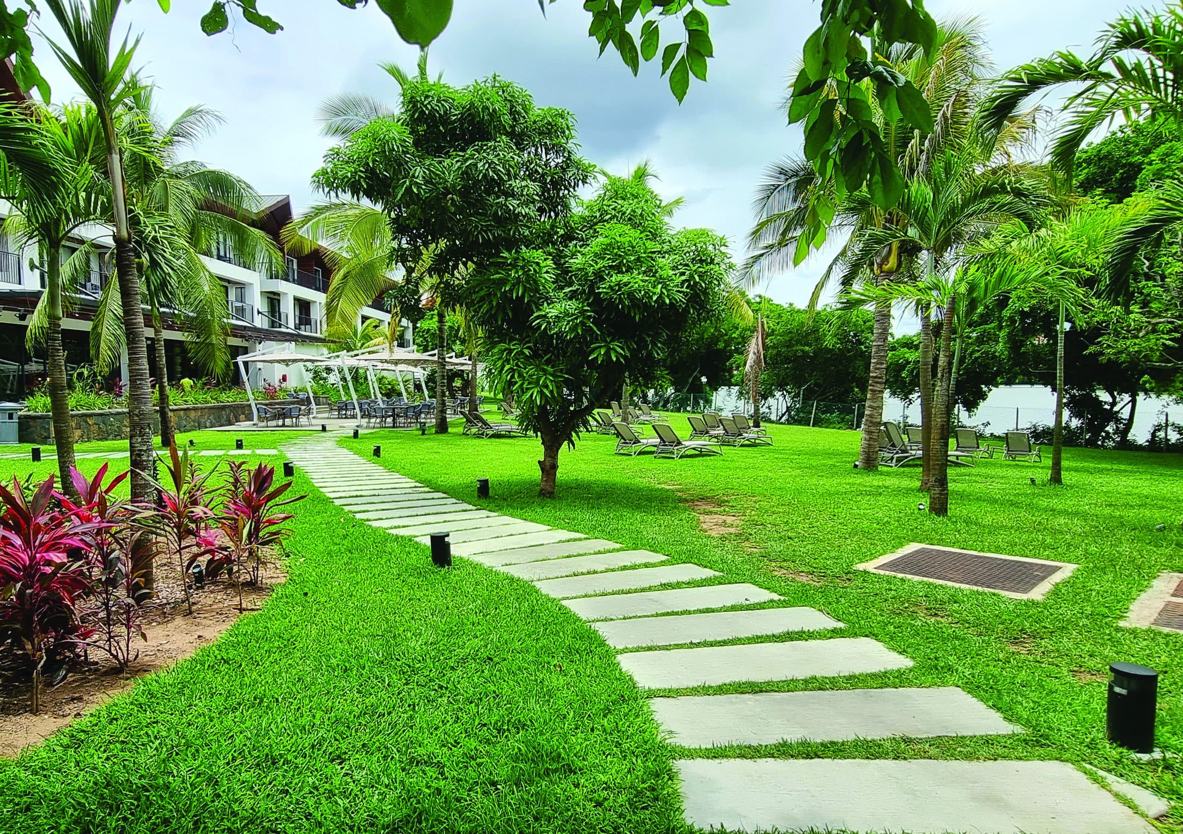 Garden path winding through a resort landscape